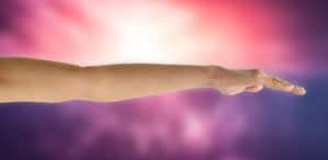 A womans arm extended outward, palm facing down, as you would for muscle testing