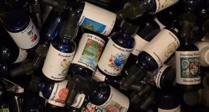 A whole bunch of flower essence bottles tossed in a drawer