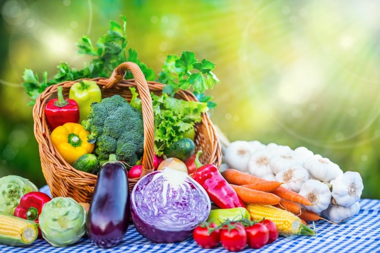 basket overflowing with colorful vegetables and fruits