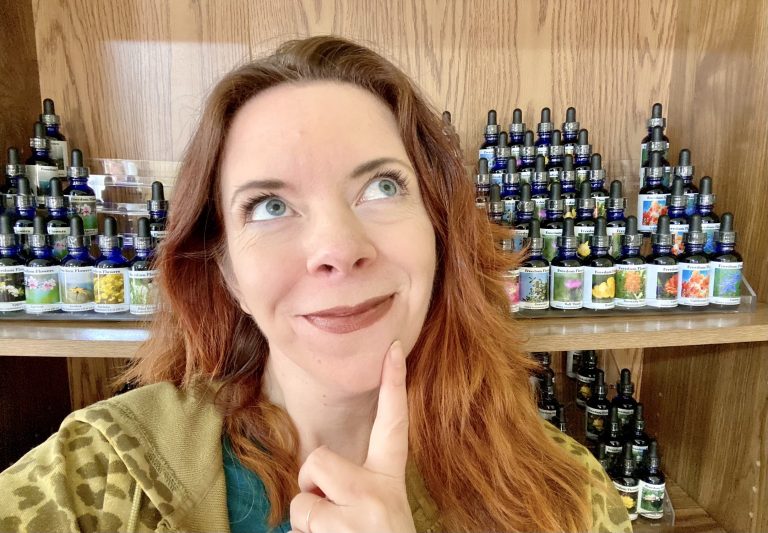 Seneca in front of flower essence bottles thinking